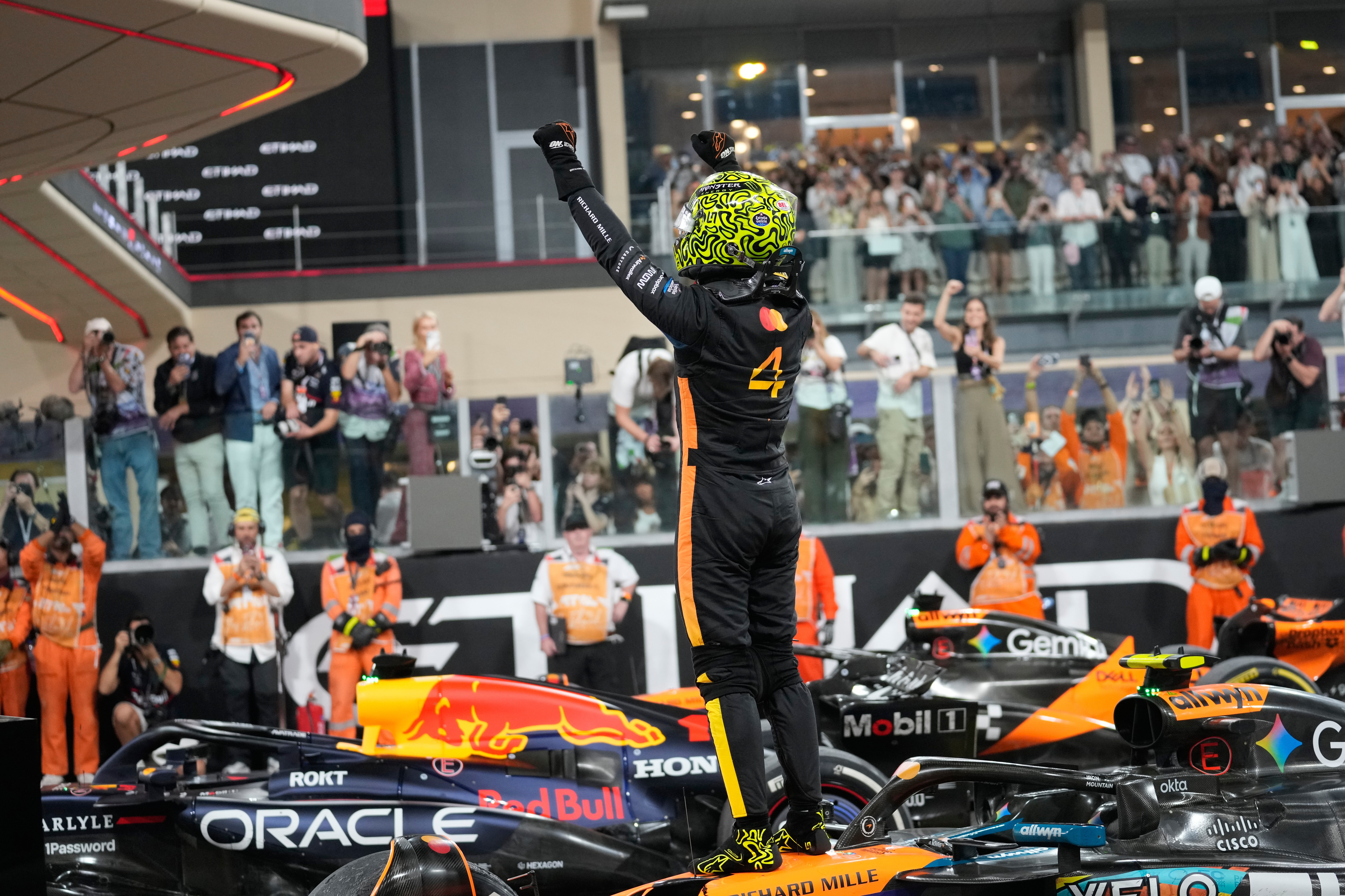 McLaren driver Lando Norris of Britain reacts after becoming a world champion after the Abu Dhabi Formula One Grand Prix in Abu Dhabi, United Arab Emirates, Sunday, Dec. 7, 2025.